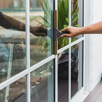 Window film being applied with a squeegee